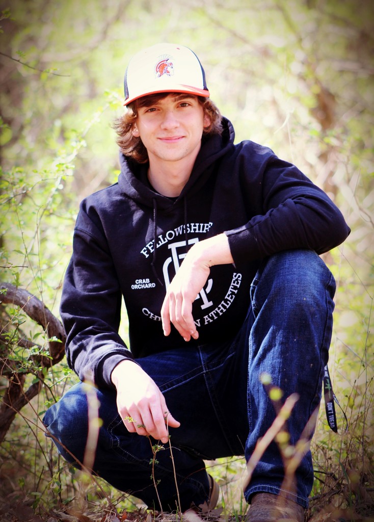 Boy senior picture in the woods