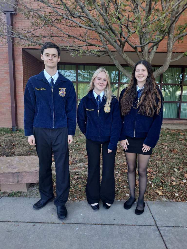 One young man and four young women in navy blue FFA jackets