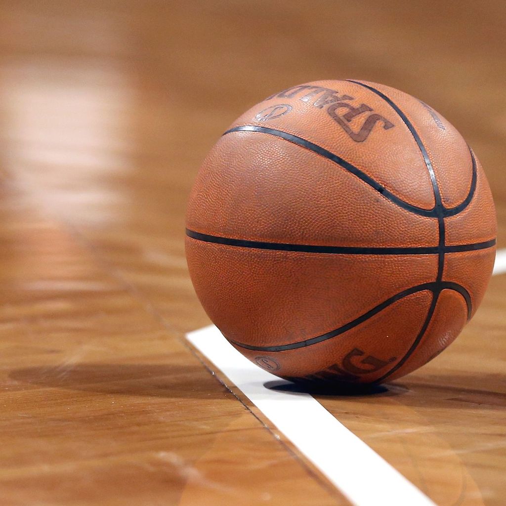 basketball touching a white boundary line