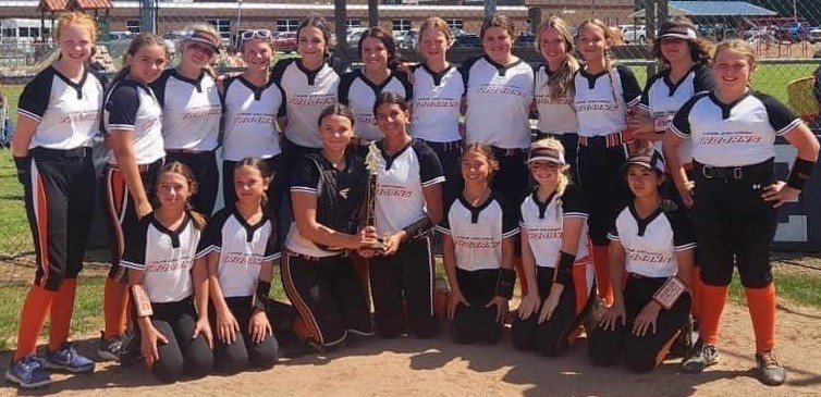 softball team in black & white uniforms with orange socks